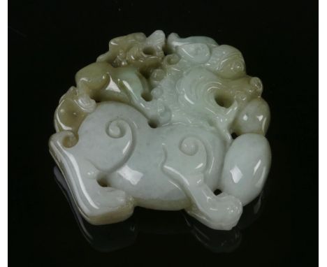An antique Chinese Jade Lion ornament, featuring a bicolour natural jade carving of temple lion with puppy at the back, has g