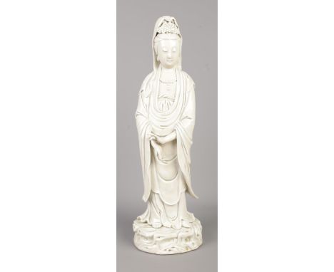 A Chinese blanc de chine figure of Guanyin. Having impressed seal mark to back. Height 44cm.