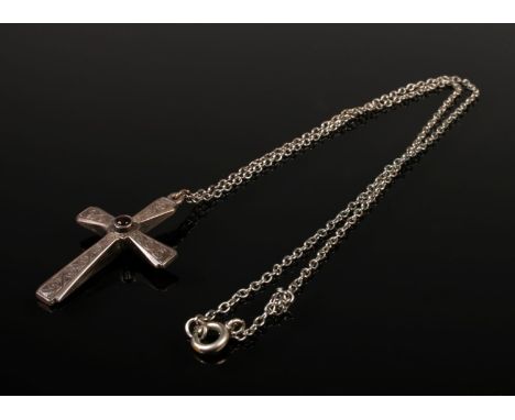 A vintage sterling silver cross pendant with a white metal chain, featuring a Stanhope lens at the centre that displays the L