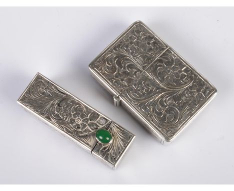 An early 20th century Continental silver lipstick case along with a similar lighter. The lipstick case with hinged mirror and