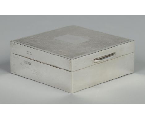 An Elizabeth II silver cigarette box with engine turned engraving. Oak lined. Assayed Birmingham 1967. Gross weight 217g.