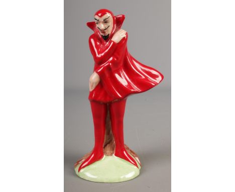 A Carlton Ware red mephisto figurine marked 'Trial' to base  Very small nibble to base.