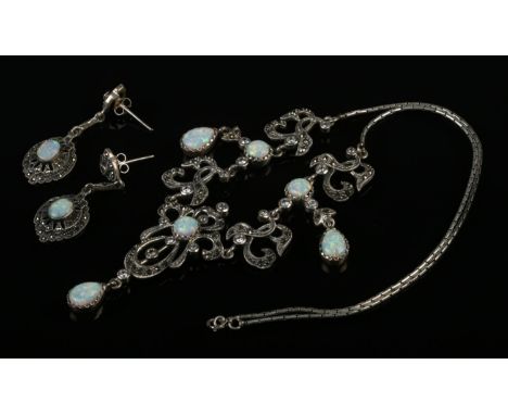 A silver opal necklace with matching opal earrings.  Hallmarked 925. Chain length 32cm.