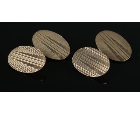 A pair of vintage 9ct yellow gold cufflinks with engine turned engraving. 8g.