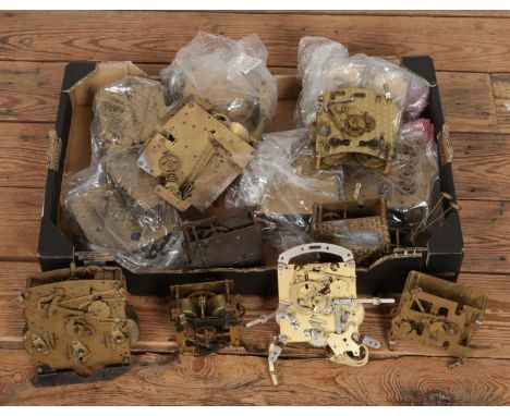 A box of assorted mantle clock movements with examples including Empire, Garrard and Smiths