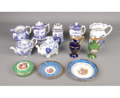 A mixed ceramic collection, including a vintage blue and white "Willow" pattern jug and teapots by Ringtons, James Sadler and