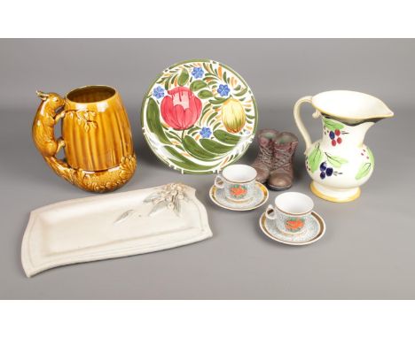 A collection of assorted ceramics to include Sylvac squirrel jug, Black Cat Pottery, Lomonosov chicken tea cups and saucers, 