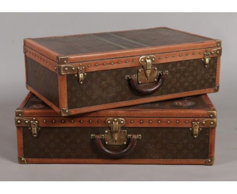 Two vintage graduated Louis Vuitton Alzer trunk suitcases. Both bearing the matching Serial Number 069259. 22cm x 76cm x 47cm