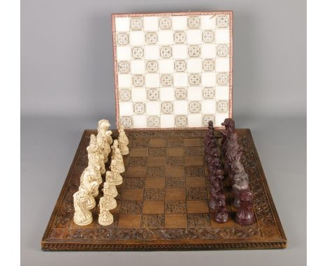 A complete composite chess set with carved board along with a tile top example.