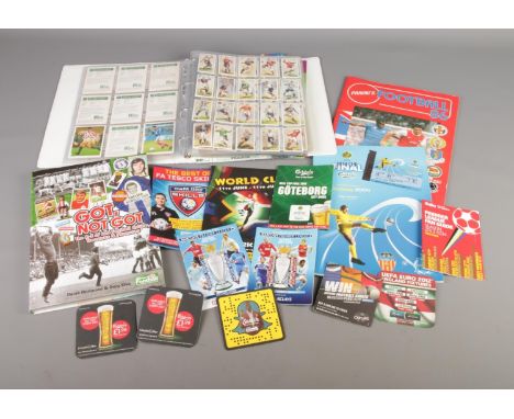 A quantity of football collectables to include Panini's 1986 sticker album, album of assorted cigarette cards, UEFA Cup 2004 