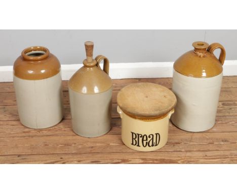 A collection of assorted stoneware to include several flagons and a wooden lidded bread bin by T.G.Green.