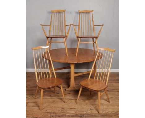 An Ercol light Sutherland style dining table, together with four Ercol Blonde Elm 'Goldsmith' chairs, two carvers.  Wear to t