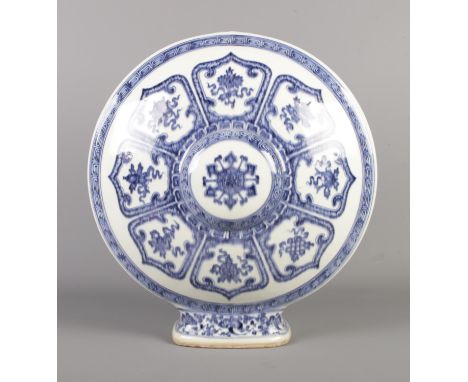 A Bajixiang blue and white moon flask, bearing Kangxi reign marks to base. Height 41cm.  Missing neck and handles.