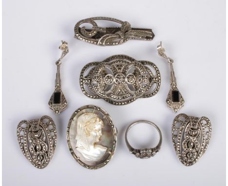 A quantity of silver marcasite jewellery, to include brooch, cameo brooch, clip on earrings, ring and tie slide/dress clip. T