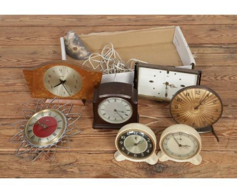 A collection of vintage clocks including mostly Smiths examples with one Kienzle example.