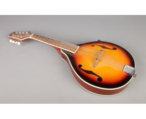 "Martin Smith" Mandolin, 8 string flatback and hollow F-holed body.  Length 70cm, in good condition.