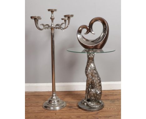 A contemporary side table in the form of a cheetah with glass top, large candelabra and modern sculpture