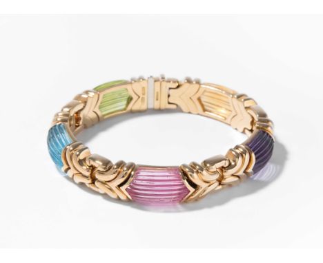 Bulgari Farbedelstein-BraceletItalien. Signiert. Modell "Alveare". 750 Gelbgold. Mit graviertem Peridot, Topas, Rosa-Turmalin