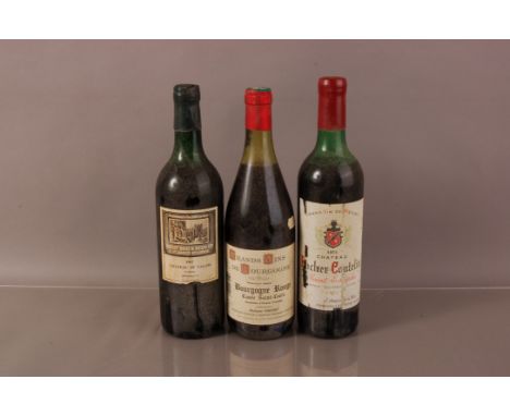 Three vintage bottles of French wine, inlcuding a 1971 Chateau Rocher Coutelin, a 1967 Chateau de Valois and a Grands Vins du