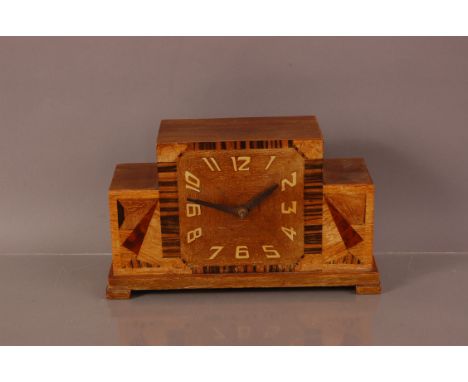 An Art Deco wooden mantle clock, 25cm wide