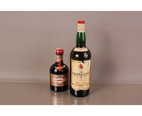 A vintage one litre bottle of Glenlivet single malt Whisky, together with a small bottle of Drambuie (2)