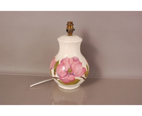 A modern Moorcroft Pottery lamp base, 25cm, plus light fitting, in Magnolia design