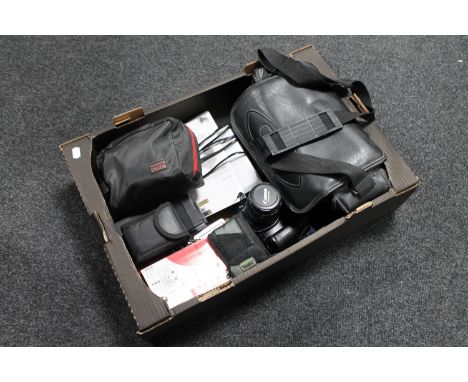 A box of assorted cameras to include a Canon EOS 1000F, Fujifilm Instant Camera, Olympus digital camera, together with a JVC 