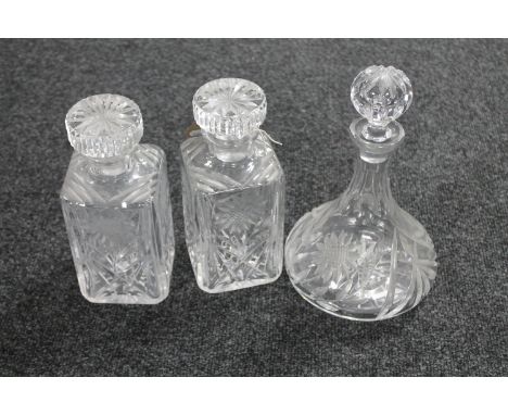 Two lead crystal whisky decanters together with one other decanter 