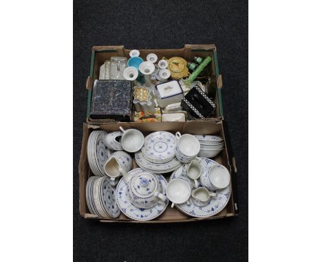 Two boxes containing an English blue and white pottery tea and dinner service, butter dishes and covers, china candlesticks, 