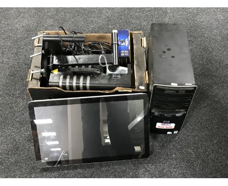 An HP disc drive together with an advertising display screen and a box containing assorted electricals including tyre inflato