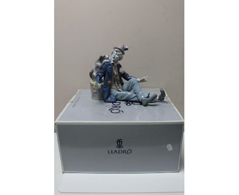 A Lladro china figure : Musical Partners, model number 5763, height 21 cm, length 30 cm, in original box. 
