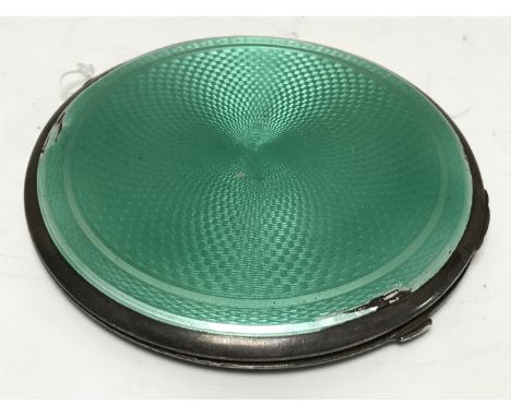 An Art Deco silver and green enamel circular powder compact, Birmingham 1932.