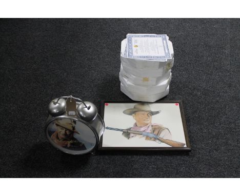 A framed John Wayne print together with a John Wayne oversized alarm clock and five collector's plates with certificates 