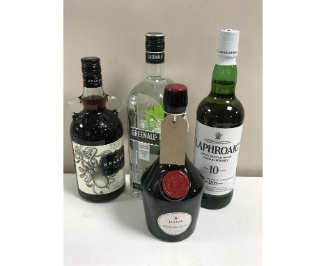 Four bottles of alcohol; a 1l bottle Greenall's Dry Gin, 70cl bottle of The Kraken Black Spiced Rum, 70cl bottle of Laphroaig