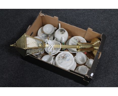 A box containing Japanese tea service, beer stein, a brass table lamp in the form of a street light 