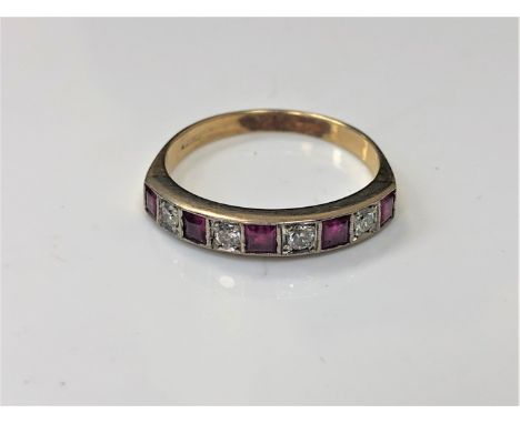 An 18ct gold ruby and diamond half eternity ring