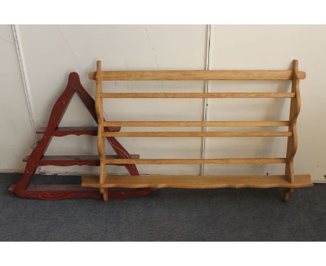 A blonde oak wall shelf and painted triangular wall shelf 