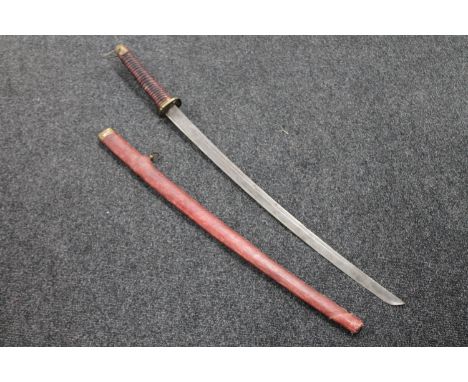 A reproduction Japanese katana in scabbard 