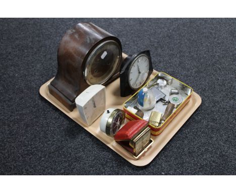A tray containing a 1930's oak mantel clock together with four other assorted mantel, alarm and travel clocks, together with 