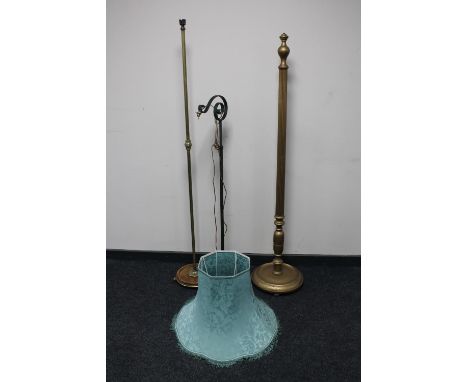 A painted gilt standard lamp with shade together with an antique brass floor lamp and an adjustable antique French bridge arm