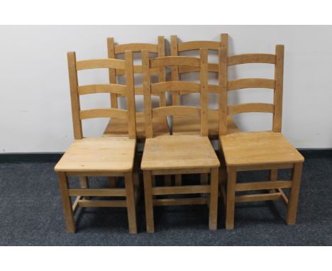 A set of five pine ladder back kitchen chairs 