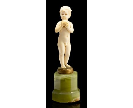 Ferdinand Preiss, Boy with Apple, an Art Deco carved ivory figure, circa 1925, on octagonal section green onyx base, apparent