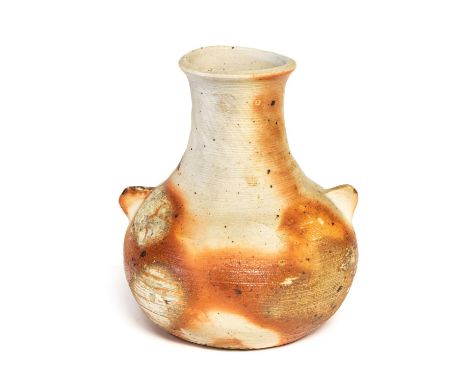 Janet Leach, a St Ives studio pottery vase, baluster form with wing handles, woodfired with rust staining and celadon patches