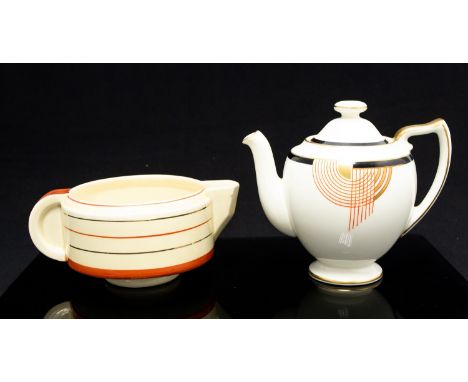 Royal Doulton Tango Art Deco teapot, ovoid form, black and red geometric design, together with a Clarice Cliff concentric rin