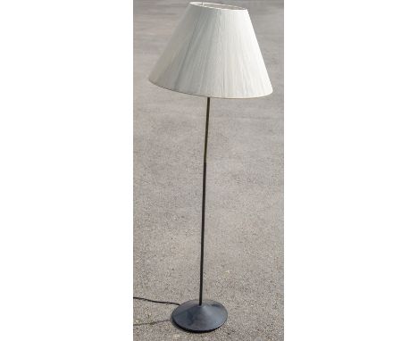 A 1950s style standard lamp, black painted cast metal and brass, with shade