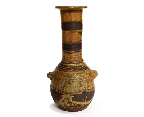 Janet Leach, a St Ives studio pottery vase, bottle form with wing handles, alternating bands of mottled orange celadon glaze 
