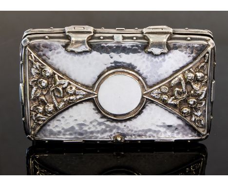 An Arts and Crafts silver cigarette case, in the style of Ramsden and Carr, circa 1924, hand hammered with applied cast open 