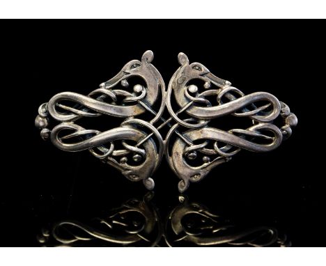 Ola Gorie, a Scottish silver brooch, Celtic style with knotted zoomorphic figures, Edinburgh, date indistinct, 6cm long
