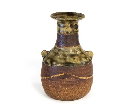 Janet Leach, a St Ives studio pottery vase, small bottle form with two wing handles, bands of motteld celadon and ash glaze b