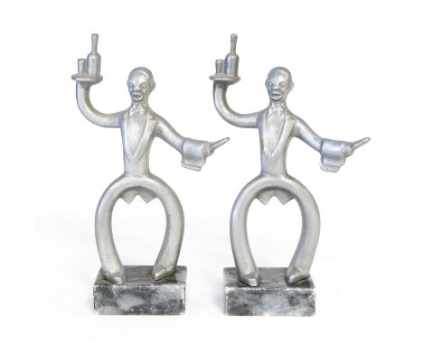 A pair of Art Deco aluminium bookends, in the form of waiters, holding trays (2)
